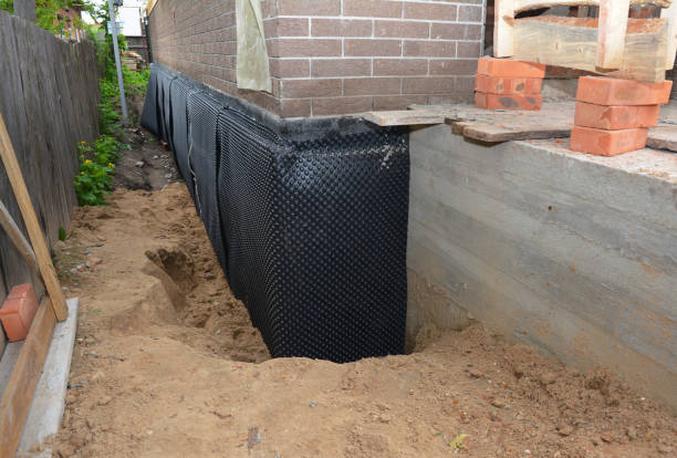 Happy homeowners after waterproofing job in Brownsboro